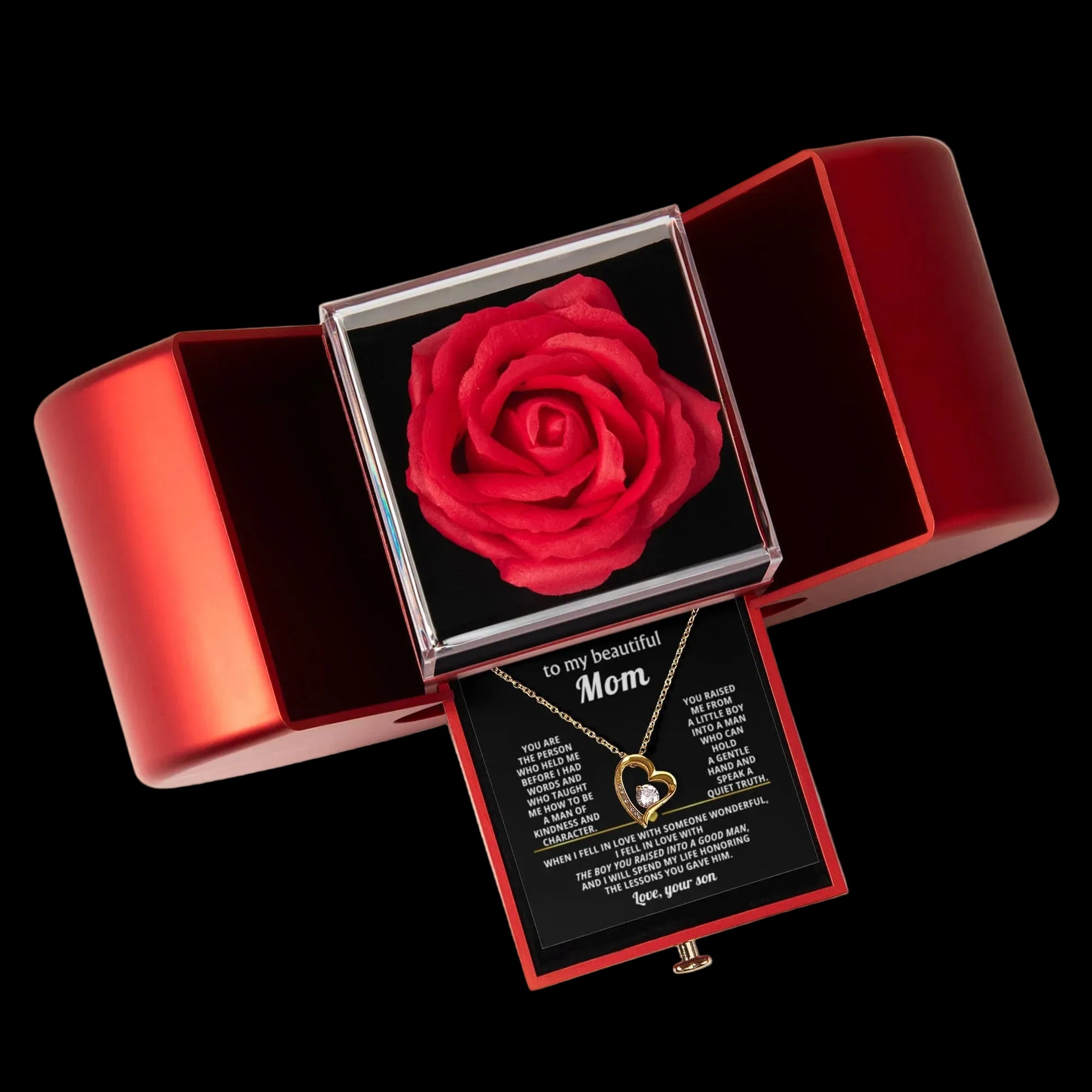 Red rose in a jewelry box with a necklace and card inside on a gray background